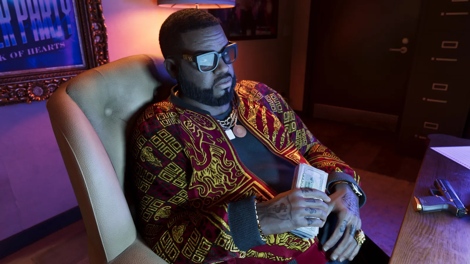 Boobie Ike in a red and gold patterned jacket and square glasses, sitting in a leather armchair holding a stack of banknotes, a pistol on the desk beside him
