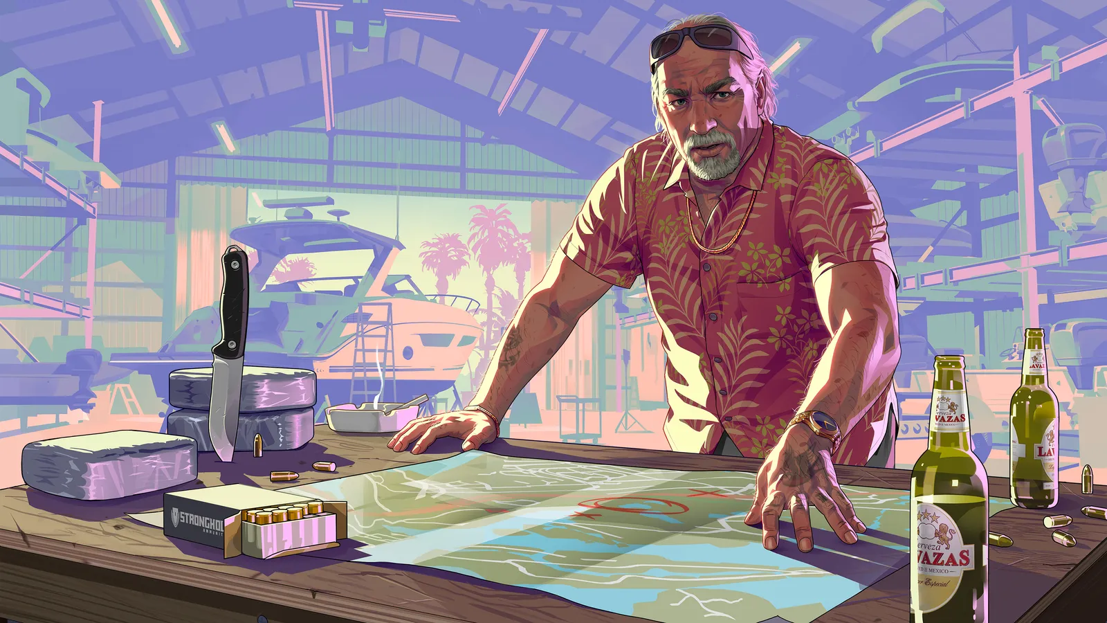 Brian Heder leaning over a map table with a knife, a box of ammunition, a wrapped package and beer bottles