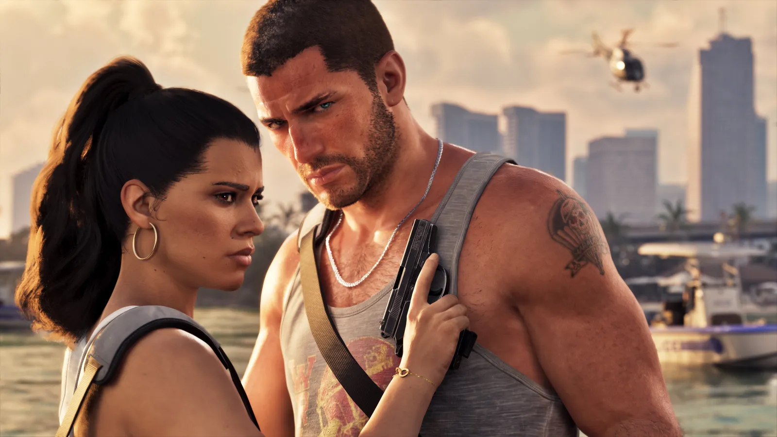 Lucia and Jason stand close on a waterfront, Lucia's hand on the pistol Jason holds against his chest, a boat and a helicopter behind them