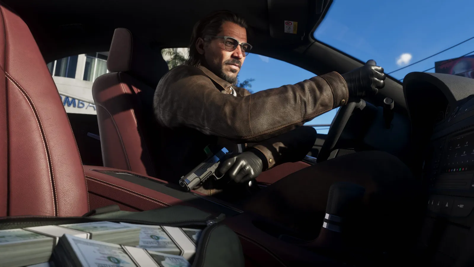 Raul Bautista in a leather jacket and gloves drives a car with a handgun in his hand, stacks of cash beside him